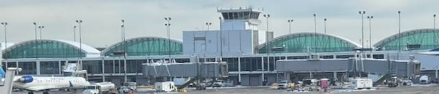 Airport terminal with arched windows and aircraft at the gates